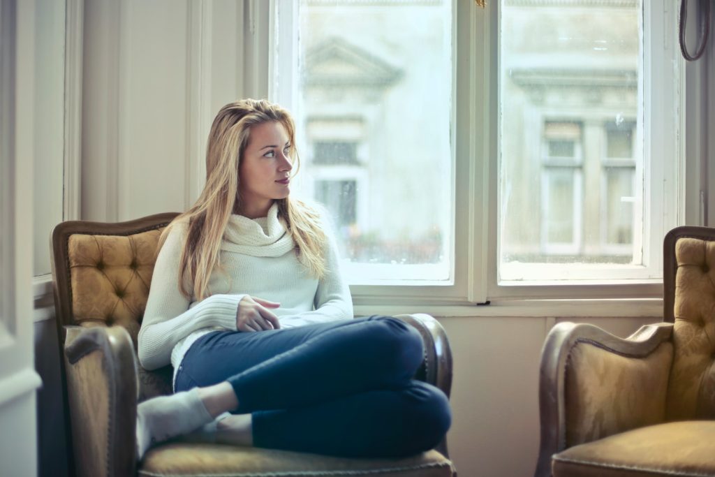 woman sitting and thinking about the fears she is going to be facing
